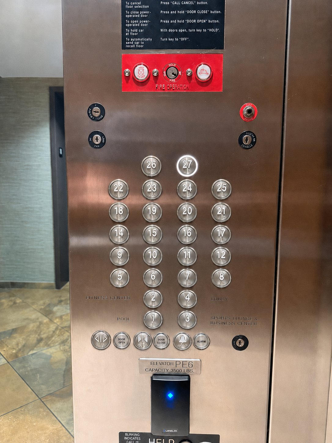 Elevator cab panel — engraved metal numerals
